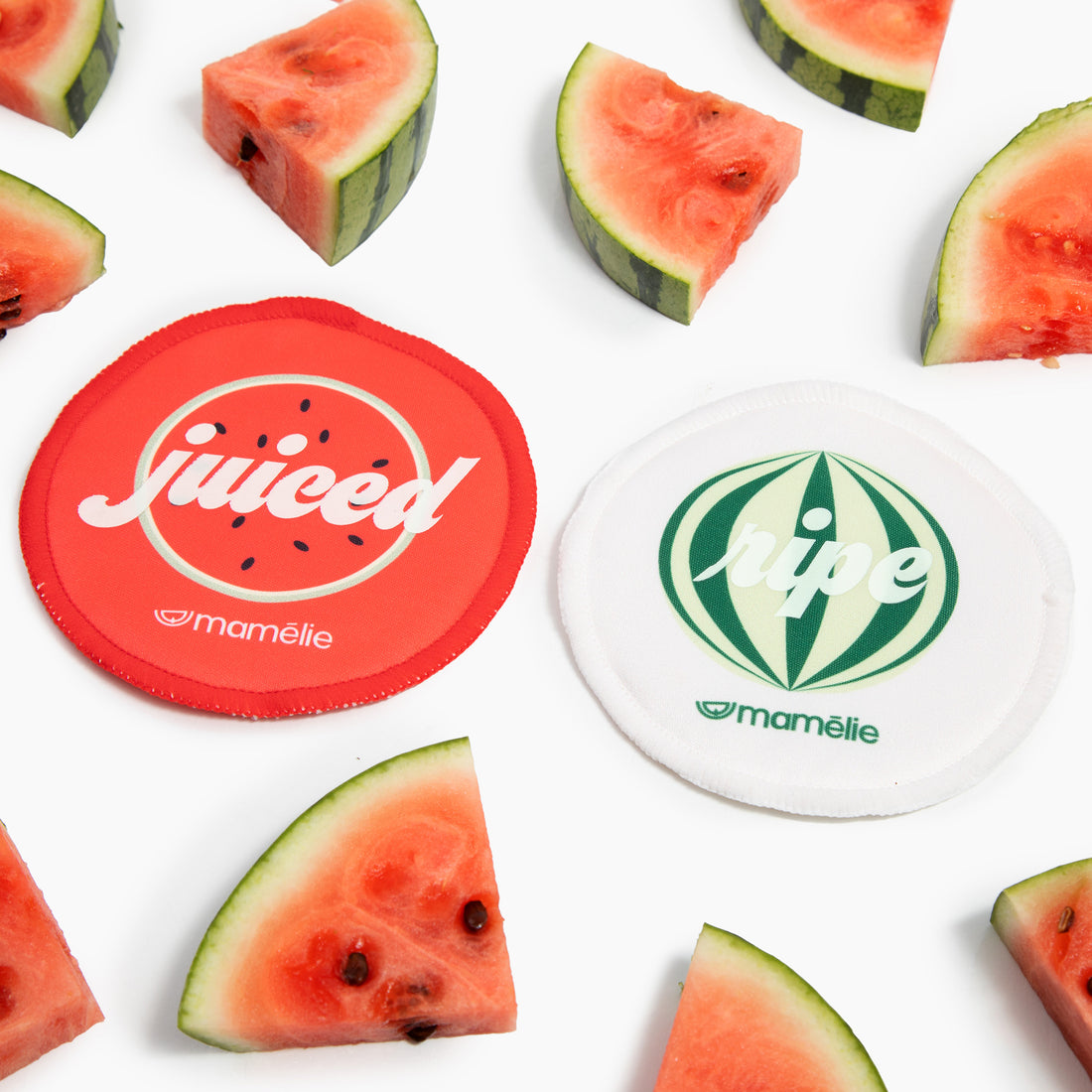 Mamélie® nursing pads surrounded by watermelons to represent full breasts